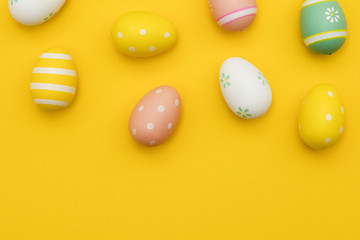 Painted easter eggs on a bright yellow background