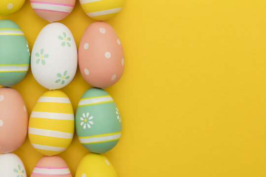 Painted easter eggs on a bright yellow background