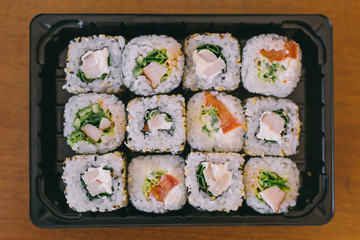 The sushi on the table in the delivery package, ordered in sushi roll