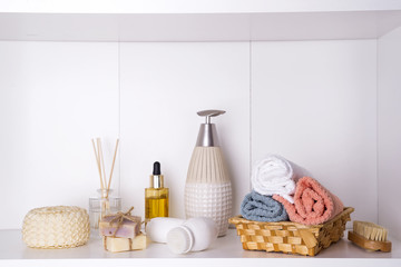 Composition with spa cosmetic, candles and brush for face, isolated on white