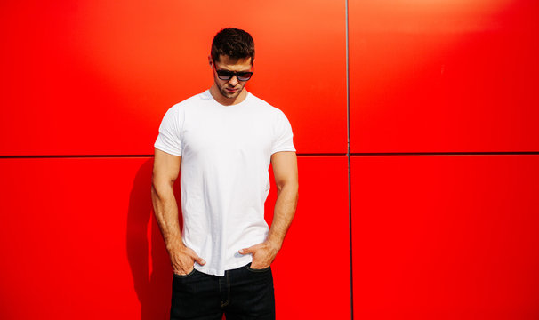 Fashion guy posing with white t-shirt with space for your logo