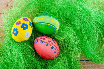 Decorated easter eggs laying on green grass
