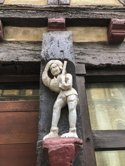 Old wooden sculpture of 15th century on a house in Le mans, France