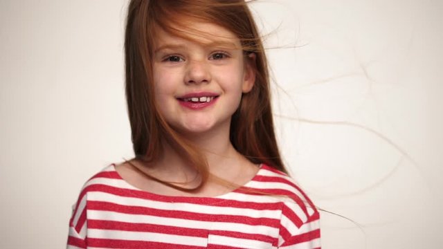 Little red haired girl smiling