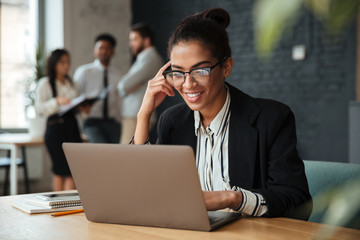 Cheerful young african business woman