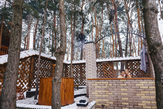 Beautiful Couple In The Hot Tub In The Winter