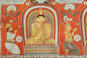 Fototapeta na wymiar People worshiping Buddha on fresco of the 14th century temple Lankatilaka Vihara with decorated walls. Sri Lanka heritage
