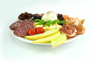 Fruit plate with ham and salami