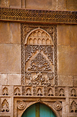 Fototapeta na wymiar Carving details on the outer wall of the Sidi Sayeed Ki Jaali (Mosque), Built in 1573, Ahmedabad, Gujarat