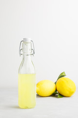 llemonade on a light background. summer traditional Italian home-made drink from Sicilian lemons. a drink of yellow color. articles made of fruits. summer background with a picture of a drink