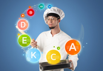 Handsome cook with vitamin concept