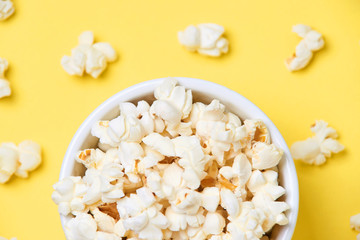 Fresh pop corn. Blurred yellow background. Fried corn