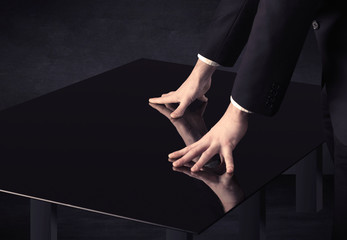 Close up of a hand touching smart table with copy space