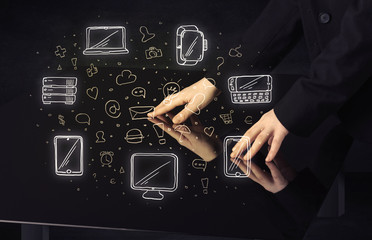 Man pressing table tablet hand touch interface with media icons