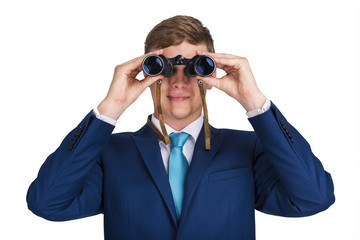 Businessman looking binoculars, blue suit isolated over white background.