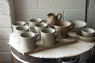 Work in progress standing on the top of the kiln in a ceramic artists home pottery studio