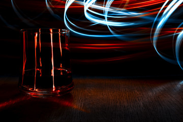 A glass of cognac on the table.