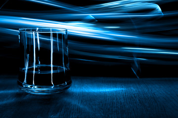 A glass of cognac on the table.