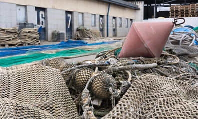 Photograph of a fishing port on a cloudy day. T