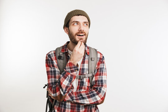 Portrait of a cheerful bearded man in plaid shirt