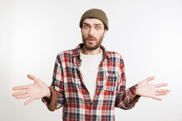 Portrait of a confused bearded man in plaid shirt