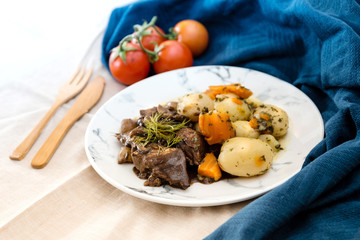Beef meat stewed with potatoes-Traditional French cuisine Beef Bourguignon potatoes carrots in persillade
