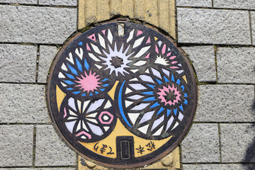 Colored manhole cover in matsumoto Japan