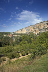 Fototapeta na wymiar Europe, France, Quercy, Lot, old stone houses are built on the cliffs above the village at Sauliac Sur Cele