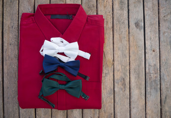 Flat lay set of male shirt and various color bowtie