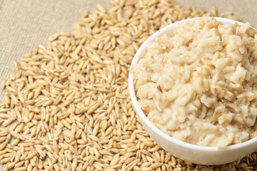 Neutral light background. Raw porridge. Welded porridge