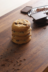 cookies with chocolate on a wooden background