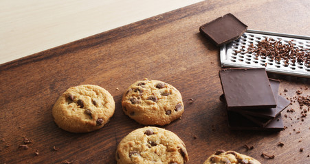 cookies with chocolate on a wooden background