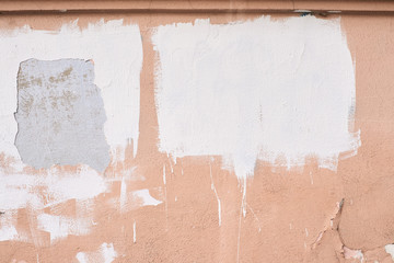 Old beige paint. Uneven coating. White strokes