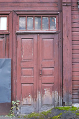 Old brown wooden door. Wooden building