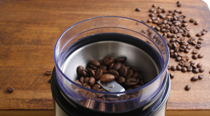 coffee beans in an electric coffee grinder