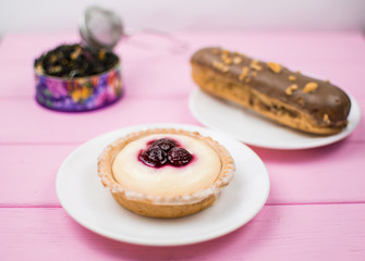 A set of different cakes on a white plate.