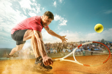 The one jumping player, caucasian fit man, playing tennis on the earthen court with spectators - obrazy, fototapety, plakaty