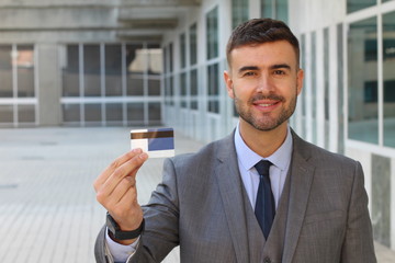 Businessman showing card in office space 
