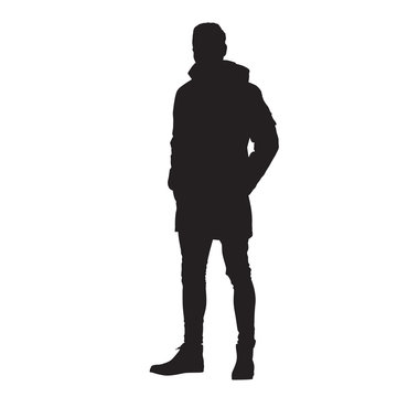 recommend clip art: Man standing in winter jacket with hands in his pockets, isoalted vector silhouette