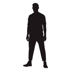 Man standing confidently facing forward with his legs crooked, isolated vector silhouette