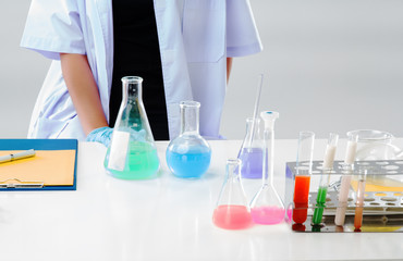 The chemist is working by test tube with reagent in lab,the Scientific experiment,