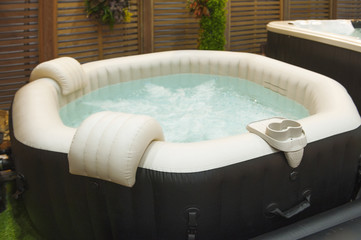 White octagon bathtub. Whirlpool and bubble in bathtub.