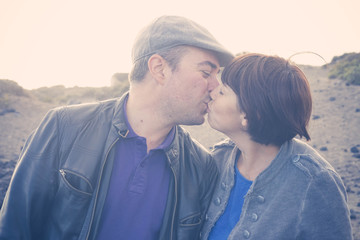 couple in love kissing in backlight