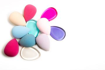 Silicone foundation sponge and beauty blenders on a white background. Empty space