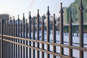 Image of a Beautiful decorative cast iron wrought fence with artistic forging. Metal guardrail...