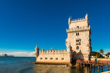 Fototapeta na wymiar The iconic quarter facade of the Tower of Belem (Torre de So Vicente) on the bank of the Tagus River.