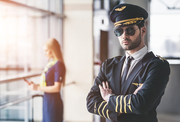 Pilot and flight attendant in airport © Vasyl
