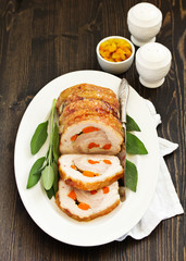 Fried pork loin stuffed with carrots and garlic. Festive dish.