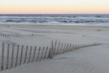 Sand Dune Fences on Beach at Sunset