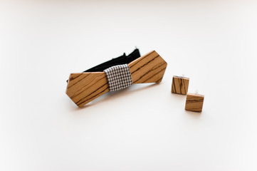 Men accessories. Elegant and stylish wooden bow tie and cufflinks